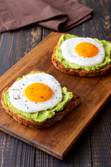Toast with guacamole and eggs. Healthy eating. Breakfast.
