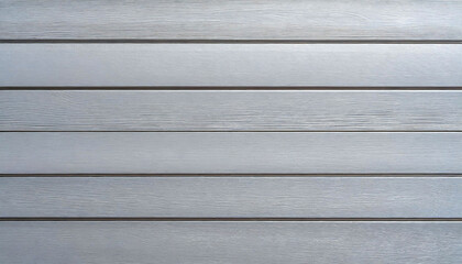Close-up of weathered, Silver-painted wooden planks aligned horizontally.