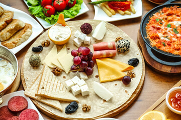 Assorted Cheeses and Meats Spread on a Table