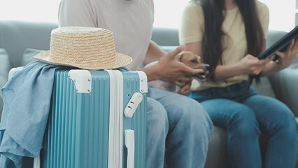 Asian woman prepare to pack clothes travel places with her friends. Asian beautiful two women friend pack things in your travel bag for holidays for her vacation trip