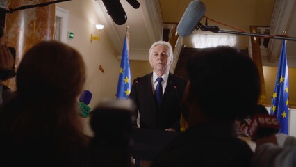 Senior EU representative comes to press conference and gives interview for TV news in government...