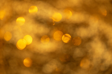 festive abstract bokeh background in golden tones