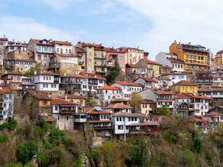 Fototapeta na wymiar Colourful houses in Veliko Tarnovo, Bulgaria on a bright morning - Landscape shot