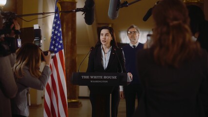 Female republican politician answers press questions, gives interview for TV breaking news in the White House. President of United States surrounded by journalists. Political speech. Election coverage