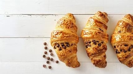 Fototapeten Crookie croissant with filling chocolate chip cookie dough. crookie croissant and cup latte. top view.  food commercial photography, free place for text. © Olga