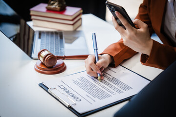 Asian legal compliance, faculty of law, legal counseoffice, a female lawyer reads a contract,...