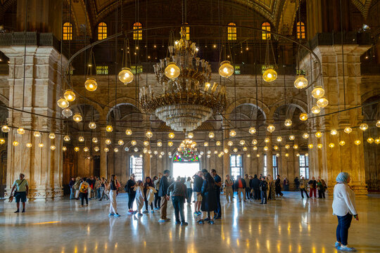 People visiting the interior of the Muhammad Ali mosque (or Alabaster mosque) in the citadel of Cairo, Egypt