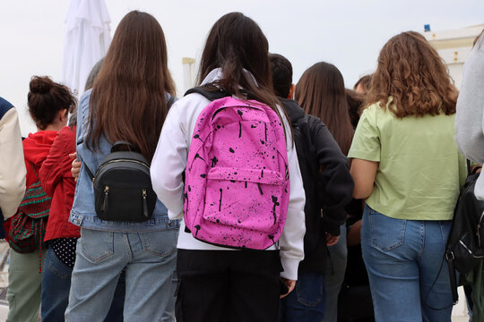 Group of Italian high school students with backpacks on their shoulders