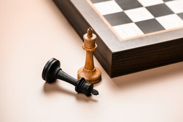 Chess pieces are white king with fallen black king. Business concept and decision strategies.
