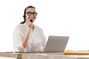 A young female consultant operator uses a microphone and internet in the office laptop. Isolated background.