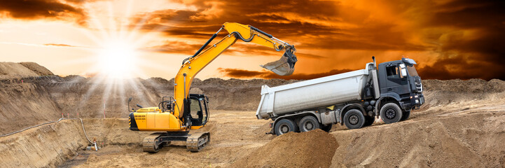  excavator is working and digging at construction site - 782179173
