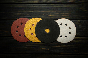 A large set of carpentry tools for polishing and cleaning boards or bars. Abrasive tools on black boards