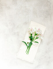 kitchen towels, cream color, with alstroemeria, Peruvian lily, top view, concept, decor, no people,