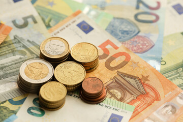 Many European euro money bills and coins. Lot of banknotes of European union currency close up
