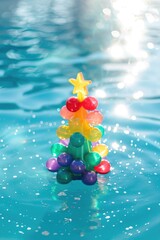 Christmas tree made of balloons floating in a pool. Great for holiday party decor