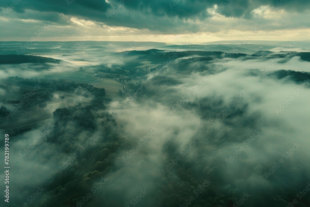 Poster aerial view of majestic mountain range with clouds in the sky. perfect for nature and travel concept