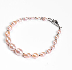 Baroque pearl bracelet isolated on white background. Top view