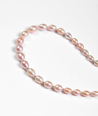 Baroque pearl bracelet isolated on white background. Top view
