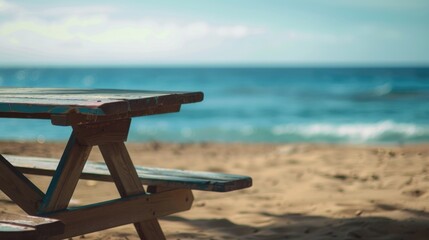 A picnic table on a sandy beach, perfect for outdoor dining