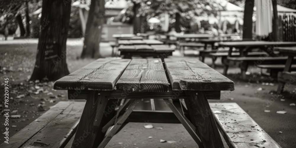 Poster A monochrome image of a picnic table. Suitable for various outdoor themes