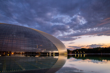 the national centre hall at sunset in Beijing, Titanium-encased, egg-shaped performance hall