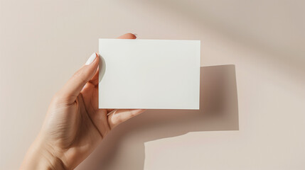 Obraz premium Create an image of a hand model holding a 5 x 7 inch card, mockup style.