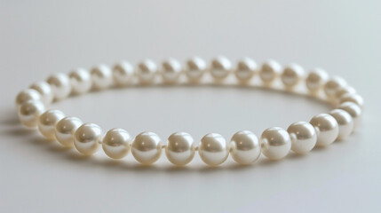 A pearl necklace on a white background