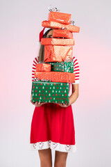 Female Santa holding pile of presents