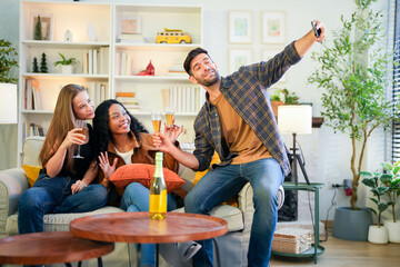 Friends capturing a joyful selfie moment with champagne, sharing laughter in a vibrant, homey...