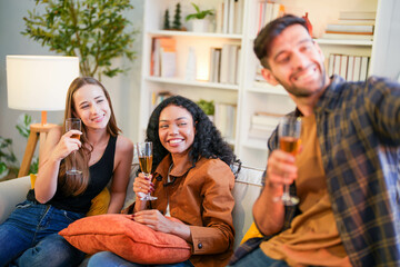 Friends captured mid-laughter as they toast in a stylish home, taking a selfie to remember the cheerful occasion