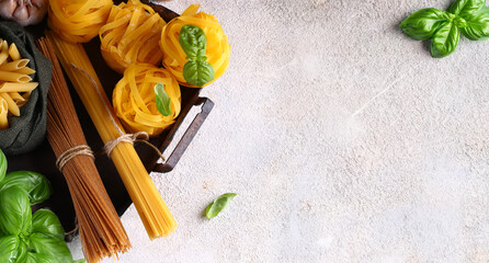 italian food pasta basil cherry tomatoes on wooden table