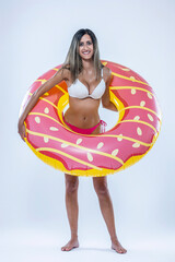 Woman in bikini with large inflatable swimming ring