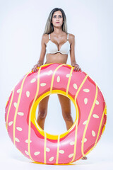 Woman in bikini with large inflatable swimming ring