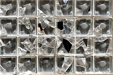 A broken window with shards of glass scattered around it. Generative AI