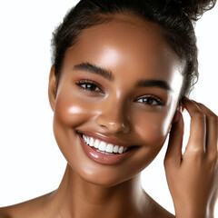 Young woman with radiant skin touches her healthy complexion in a beautiful portrait.