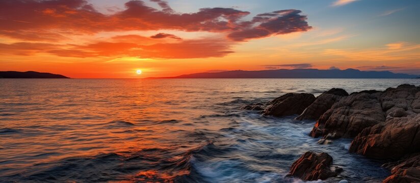 Sunset ocean view with rocky foreground