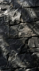 Close-up of textured black stone wall