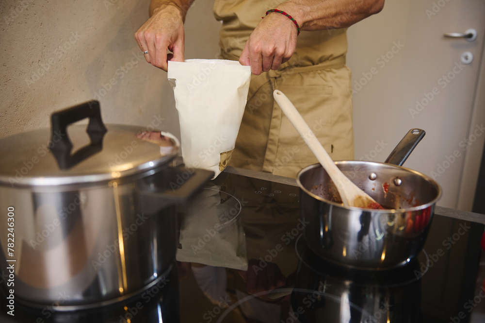 Wall mural cooking italian pasta for family dinner, according to traditional italian recipe