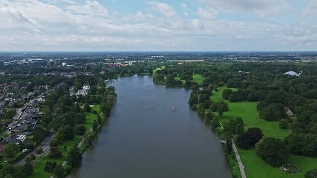 An aerial drone view of Aasee Lake in M&uuml;nster . Lake Aasee is an artificial lake located in M&uuml;nster , Germany .