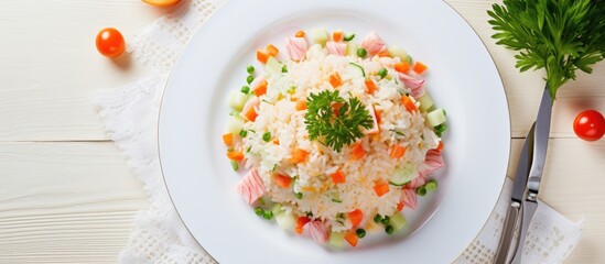 Plate of rice with cooked vegetables and meat
