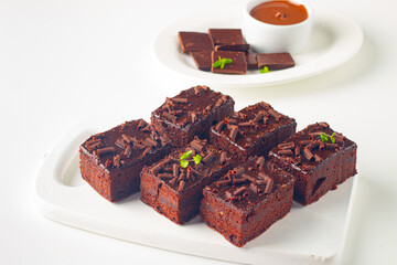 Delicious chocolate brownies with mint on white background. Sweet cake concept. 