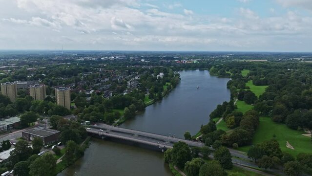 An aerial drone view of Aasee Lake in M&uuml;nster . Lake Aasee is an artificial lake located in M&uuml;nster , Germany .