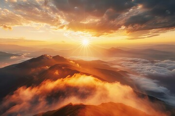 majestic sunrise over misty mountains with warm golden light and dramatic clouds landscape photography - obrazy, fototapety, plakaty