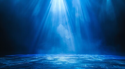 Underwater blue spotlight. Deep water with bright rays of light shining down.