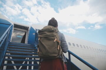 Happy attractive asian woman traveler with backpack at the modern airport terminal, copy space, Tourist journey trip concept