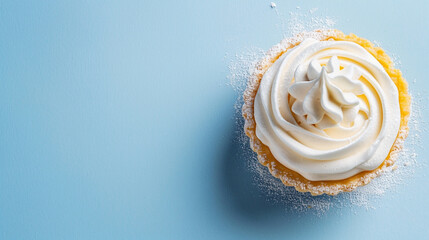 Delicious cream tart sugar blue backdrop. Top view sweet dessert. Light, shadow. Copy space - obrazy, fototapety, plakaty