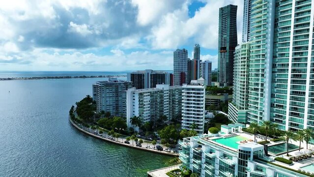 City on water with swimming pool and condo Miami Brickell 4k Drone Video 
