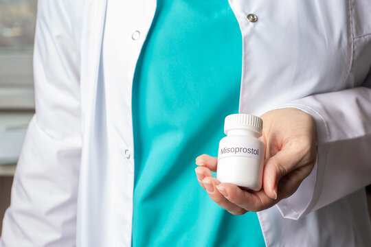 Abortion pills in doctor's hands, medical procedure, reproductive rights, healthcare access