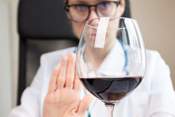 reject liquor,stop alcohol, doctor shows a sign of refusal of wine