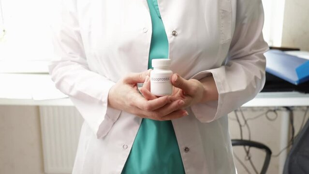 Abortion pills in doctor's hands, medical procedure, reproductive rights, healthcare access